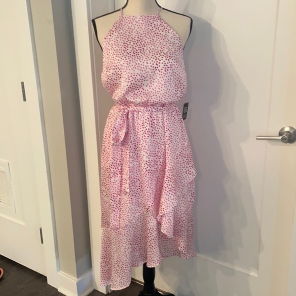 Dotted high neck, asymmetrical fit and flare dress